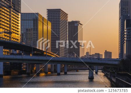 Nakanoshima buildings bathed in the morning glow (near Watanabebashi) Nakanoshima buildings bathed in the morning glow (near Watanabebashi) 125673785