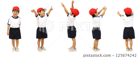 A boy wearing a red and white hat and gym clothes on a white background A boy wearing a red and white hat and gym clothes on a white background 125674242
