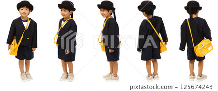 A boy in a kindergarten uniform, with a hat and a shoulder bag on a white background A boy in a kindergarten uniform, with a hat and a shoulder bag on a white background 125674243