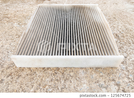 Dirty Used Car Air Filter Needing Replacement. 125674725