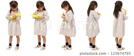 A child standing and drawing with his whole body on a white background A child standing and drawing with his whole body on a white background 125674785