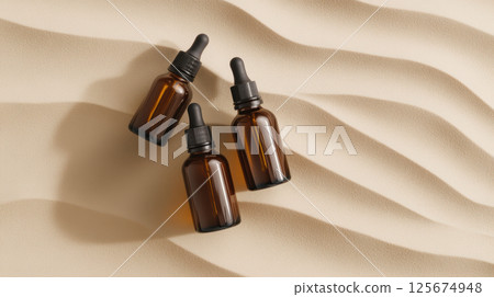 Amber glass dropper bottles on sculpted sand surface in minimalist aesthetic, highlighting natural skincare product packaging, AI Generative 125674948