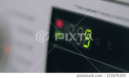 The Modern Washing Machine Control Panel operates with advanced technology for efficient laundry The Modern Washing Machine Control Panel operates with advanced technology for efficient laundry 125676305