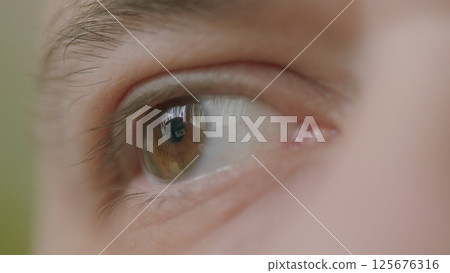 This is a CloseUp Image of a Human Eye That Captures the Extraordinary Beauty of Nature Itself 125676316
