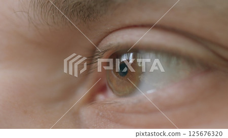 CloseUp of a Human Eye Featuring Stunning Reflection and Intricate Details and Colors CloseUp of a Human Eye Featuring Stunning Reflection and Intricate Details and Colors 125676320