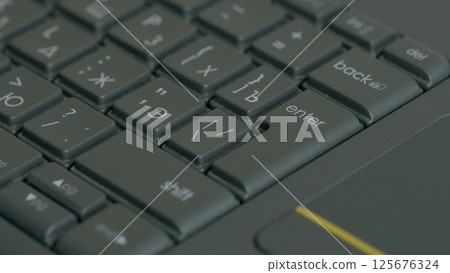 Captivating Detailed Closeup Shots of a Laptop Keyboard During Its Active Use and Functionality Captivating Detailed Closeup Shots of a Laptop Keyboard During Its Active Use and Functionality 125676324
