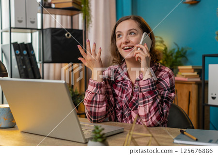 Business woman freelancer answering to client on mobile phone call using smartphone conversation 125676886