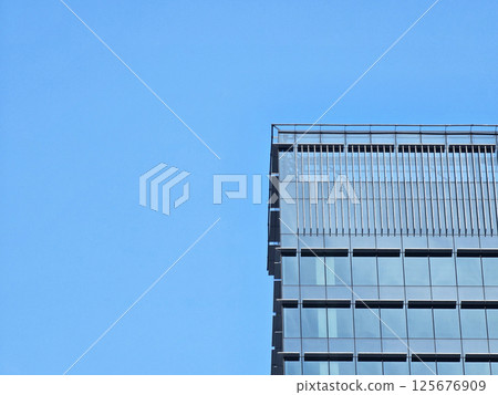 Minimal Building with Blue Sky Background with Light Beam and Shadow. 125676909