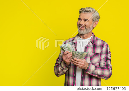 Mature man counting dollar money cash, satisfied smile, showing profit bonus wage financial success 125677403