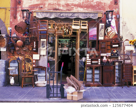 Interior goods store in the old town of Campagnano di Roma, a suburb of Rome, Italy 125677404