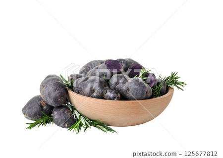 Concept of unusual vegetable - purple potato vegetable, isolated on white background 125677812
