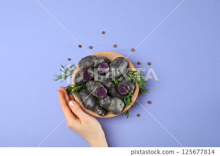 Concept of unusual vegetable - purple potato vegetable 125677814