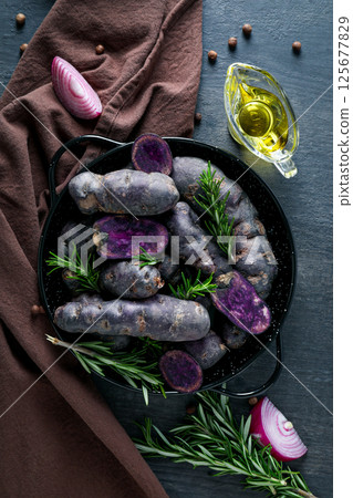 Concept of unusual vegetable - purple potato vegetable 125677829