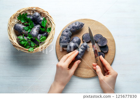 Concept of unusual vegetable - purple potato vegetable 125677830