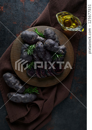 Concept of unusual vegetable - purple potato vegetable 125677831