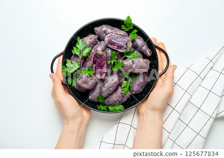 Concept of unusual vegetable - purple potato vegetable 125677834