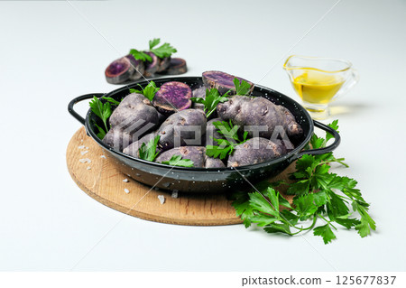 Concept of unusual vegetable - purple potato vegetable 125677837
