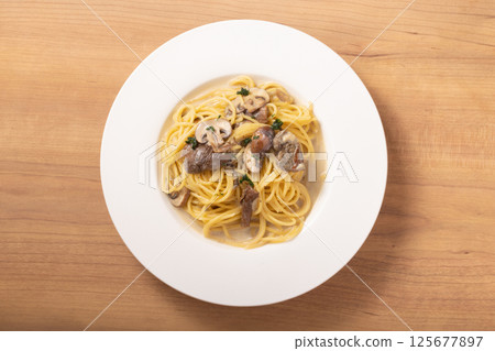 Porcini and mushroom cream pasta 125677897