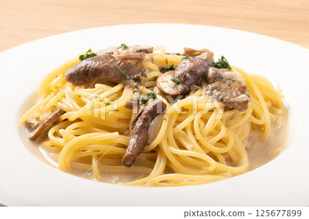 Porcini and mushroom cream pasta 125677899