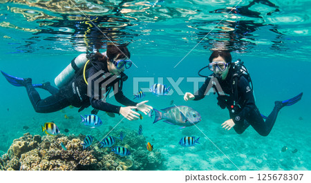 The thrill of interacting with fish at close range 125678307