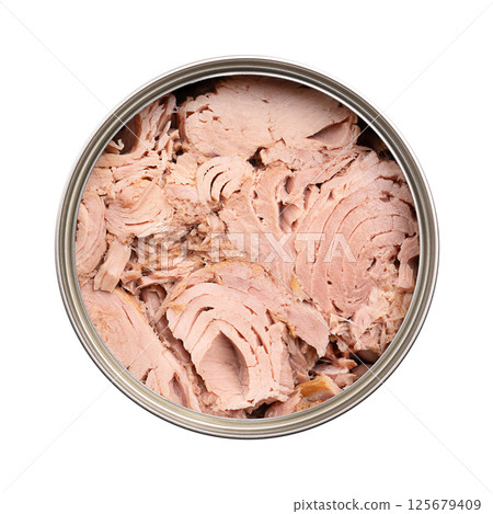 Canned tuna, tuna fish in its own juice in an open tin can, from above. Fillets of Skipjack tuna, Katsuwonus pelamis, preserved in liquid that naturally extracts from the fish during canning process. 125679409