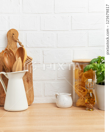 Kitchen utensils, pasta and basil showing rustic cooking and healthy food concept 125679817