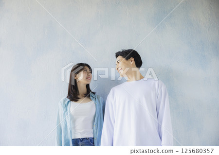 A man standing side by side A man standing side by side 125680357