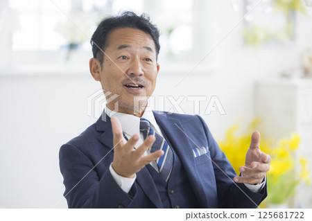 Businessman being interviewed 125681722