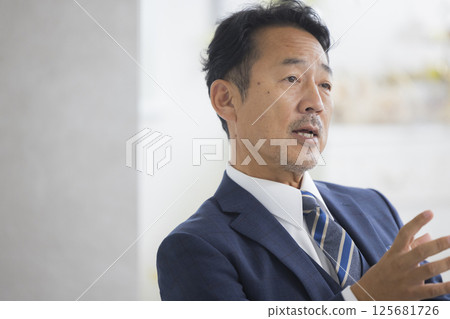 Businessman being interviewed Businessman being interviewed 125681726