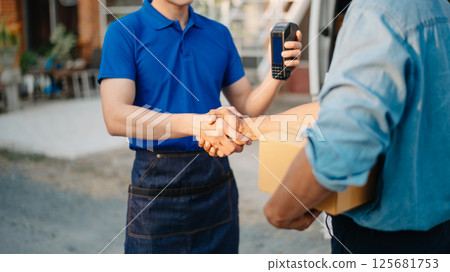 Delivery man by sending box of parcel to customers service at home as having corona virus disease and shipping concept. Delivery man by sending box of parcel to customers service at home as having corona virus disease and shipping concept. 125681753