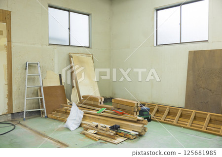 Workers working at a demolition site 125681985