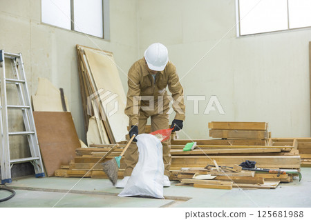 Workers working at a demolition site Workers working at a demolition site 125681988
