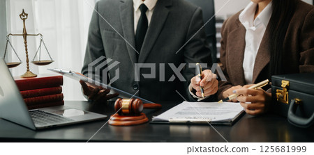 Business and Male lawyer or judge consult having team meeting with client, Law and Legal services concept.Customer service good cooperation in office Business and Male lawyer or judge consult having team meeting with client, Law and Legal services concept.Customer service good cooperation in office 125681999
