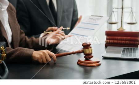 Business and Male lawyer or judge consult having team meeting with client, Law and Legal services concept.Customer service good cooperation in office Business and Male lawyer or judge consult having team meeting with client, Law and Legal services concept.Customer service good cooperation in office 125682001