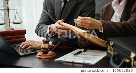 Business and Male lawyer or judge consult having team meeting with client, Law and Legal services concept.Customer service good cooperation in office Business and Male lawyer or judge consult having team meeting with client, Law and Legal services concept.Customer service good cooperation in office 125682020