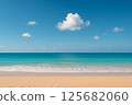 Sandy beach, blue sea, blue sky and white clouds 125682060