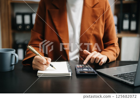 Business accountant or financial expert analyze business report graph and finance chart. banking business and stock market research. At office Business accountant or financial expert analyze business report graph and finance chart. banking business and stock market research. At office 125682072