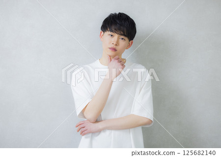 man wearing white t-shirt man wearing white t-shirt 125682140