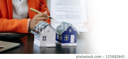 Considering buying a home, investing in real estate. Broker signs a sales agreement. agent, lease agreement, successful deal 125682641