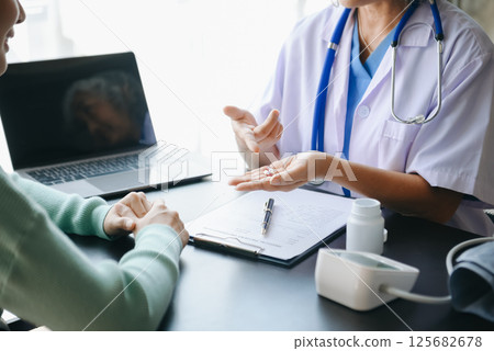 Psychology, depression. Suffering asian old woman, consulting with psychologist, psychiatrist while patient counseling mental problem. 125682678