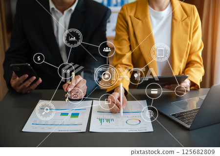 Co working team meeting concept,business with smart phone and laptop and digital tablet computer in office with virtual interface icons 125682809