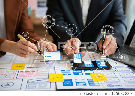 UX graphic designer planning application process development prototype wireframe for web smart phone. Creative digital development agency. 125682820