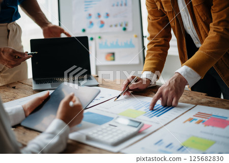 Business people meeting at office writing notes about sticky notes Laptop,tablet Planning and Brainstorming Strategies of Colleagues Business people meeting at office writing notes about sticky notes Laptop,tablet Planning and Brainstorming Strategies of Colleagues 125682830