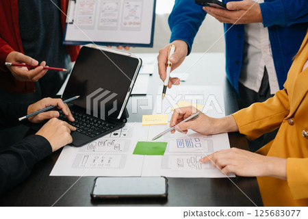 UX graphic designer planning application process development prototype wireframe for web smart phone. Creative digital development agency. UX graphic designer planning application process development prototype wireframe for web smart phone. Creative digital development agency. 125683077