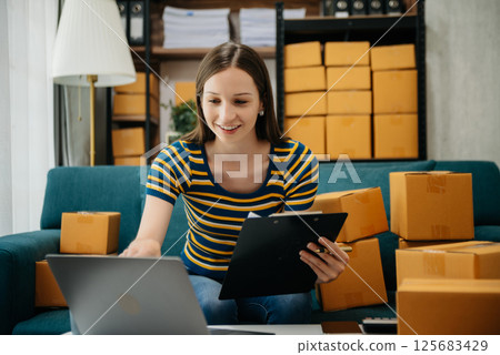 Small business entrepreneur SME freelance woman working at home office, BOX,tablet and laptop online, marketing, packaging, delivery Small business entrepreneur SME freelance woman working at home office, BOX,tablet and laptop online, marketing, packaging, delivery 125683429