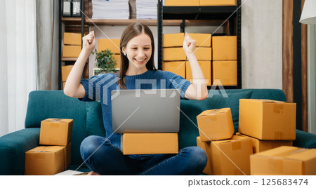 Small business entrepreneur SME freelance woman working at home office, BOX,tablet and laptop online, marketing, packaging, delivery 125683474