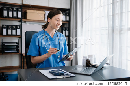 Medical technology concept. woman Doctor working with mobile phone and stethoscope in modern office Medical technology concept. woman Doctor working with mobile phone and stethoscope in modern office 125683645
