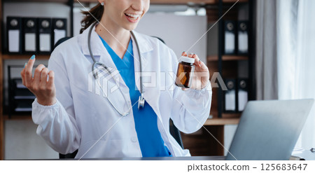 Doctor consulting with patient discussing something and Presenting results on report, Medicine and health care concept. Doctor consulting with patient discussing something and Presenting results on report, Medicine and health care concept. 125683647