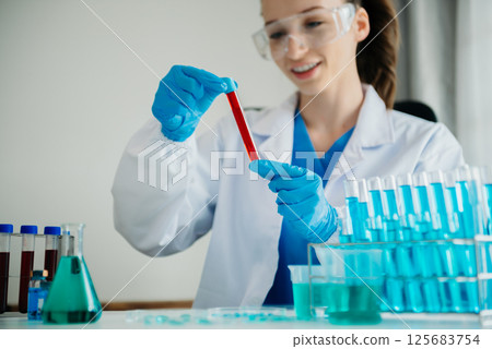 Coronavirus COVID-19 medical test vaccine research and development concept.in a chemistry lab. Coronavirus COVID-19 medical test vaccine research and development concept.in a chemistry lab. 125683754