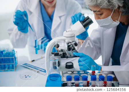 Medical team having a meeting with doctors. Young scientists conducting research investigations 125684356